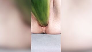Ftm masturbates hairless noisy pussy with a cucumber close up.