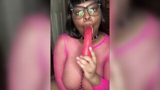 Nerdy Busty Ebony Babe Sucking on a Dildo