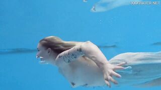 Finnish blonde tattooed pornstar Mimi underwater