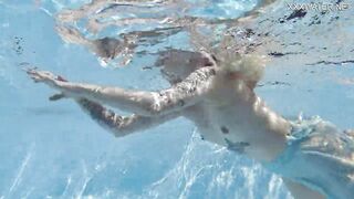 Finnish blonde tattooed pornstar Mimi underwater