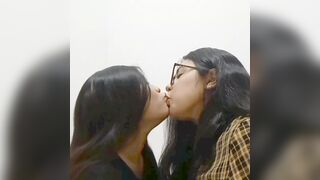 Real lesbian couple kissing