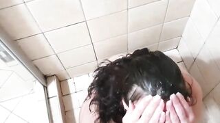 Girl washing her hair and body with piss