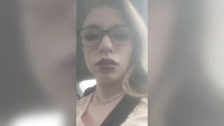 Beautiful junkie doing a shot in the car
