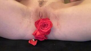 I'm mastrubating with two roses inside my tight horny pussy