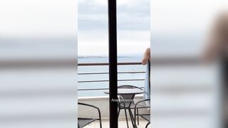 Sexy slender girl flashes her natural bare breasts on her balcony.