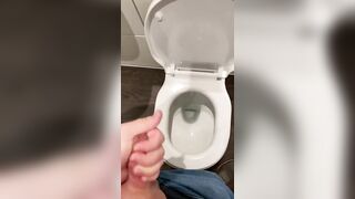 Wanking off in public cubicle with big cumshot at the end