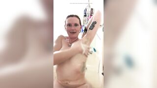 Massaging mommy's lathered up titties in the bath