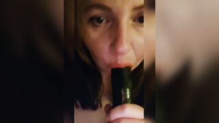 Sucking a big black dildo