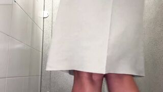 lifted her skirt and pissed at work in the toilet