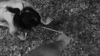 Naked submissive slut taken for a walk on a leash in forest