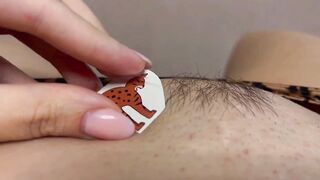 Tattoo master in leopard panty doing temporary tattoo