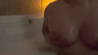 Playing with my perky boobs in the bath