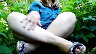 Playful MILF masturbates through panties in outdoor with her legs spread wide