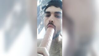 Sucking a big fat dildo